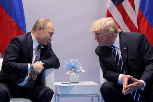FILE PHOTO: Russia's President Vladimir Putin talks to U.S. President Donald Trump during their bilateral meeting at the G20 summit in Hamburg